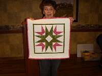 These squares were used to demonstrate paper piecing,  so Marilyn Crosby put them together in a quilt.