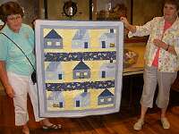 Letha Roth and Marian Gourley work together on some quilts