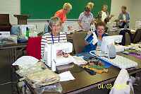 Judy Gilbert and Mary Jo Berland working on the blocks