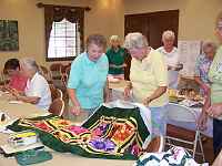 Kay showing and telling about her latest quilt
