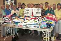 B's group donating 37 quilts to the Marion County School District. <br />These quilts go mostly to the homeless children in the Ocala National Forest.<br />Our guild has donated over 500 quilts so far to Marion County, we are over halfway to our goal of 1,000 quilts to these children.