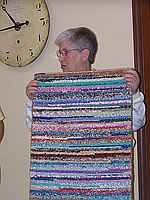 Barbara Kingsbury showing her hooked rug.